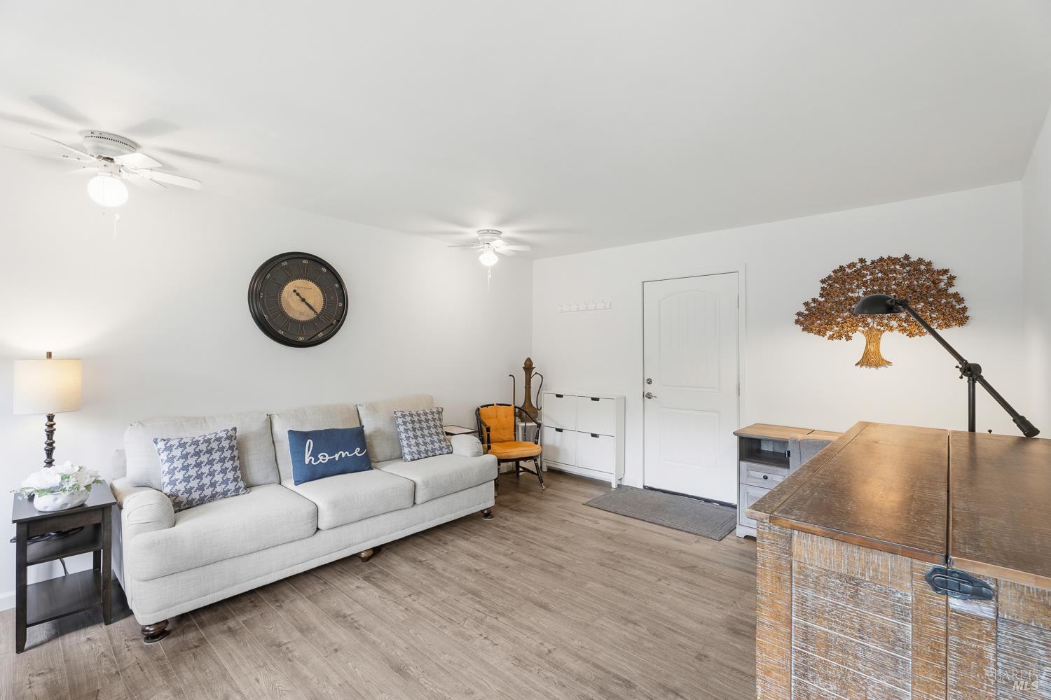 8251 East Potter Valley Road Ukiah, CA 95482 - Photo 8 of 29 a living room with furniture and a clock