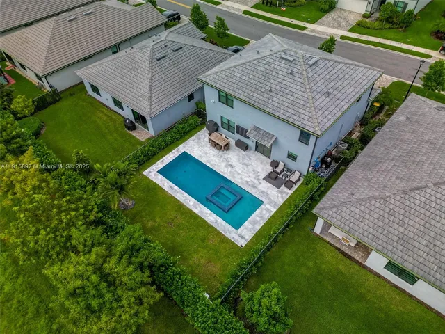 an aerial view of a house having patio
