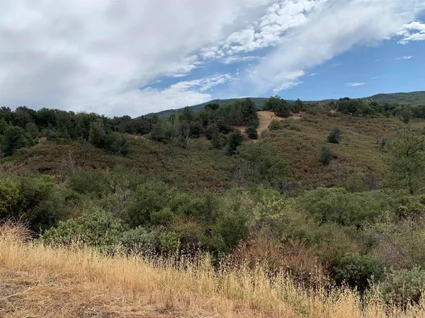 a view of a lake with mountains in background