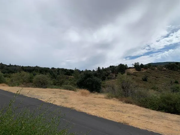 an aerial view of mountain with lake view