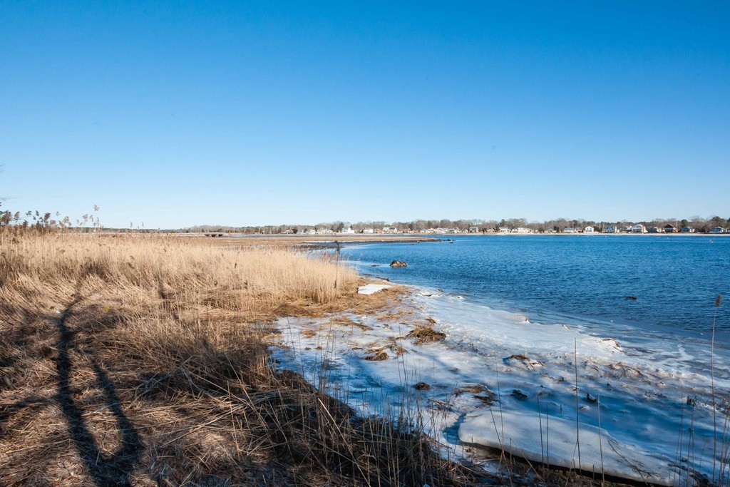 Lot 1 Wareham Road Marion, MA 02738 - Photo 4 of 23 a view of a lake with houses in the background