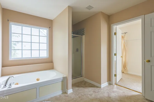 a kitchen with granite countertop a sink cabinets and stainless steel appliances