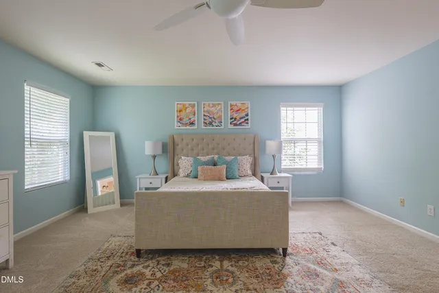 a bathroom with double vanity sinks and a mirror