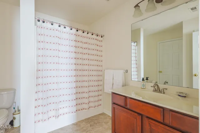a view of room with window and ceiling fan