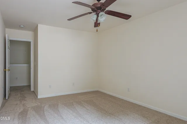 a view of workspace with wooden floor and a window