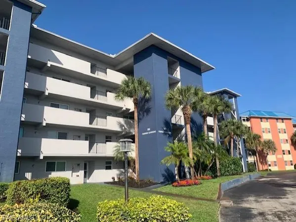 a view of a building with a yard