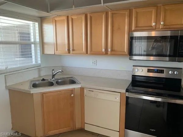 a kitchen with a stove and a microwave