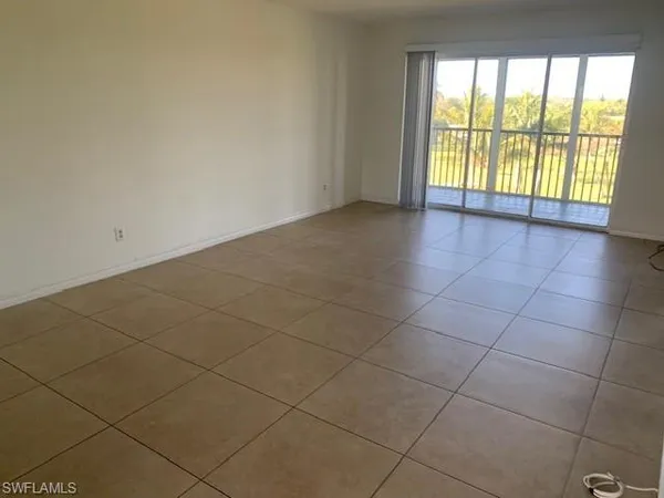 a view of an empty room and a window