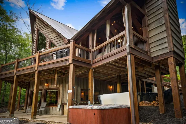 a view of a house with a yard and sitting area