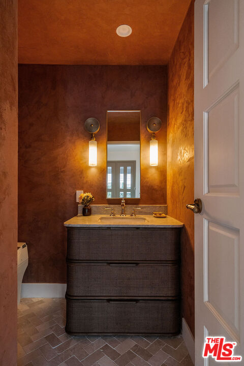 851 Dickson Street Marina del Rey, CA 90292 - Photo 11 of 39 a bathroom with a sink and a mirror