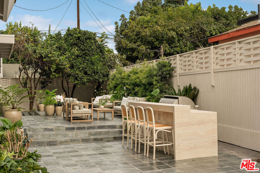 851 Dickson Street Marina del Rey, CA 90292 - Photo 19 of 39 a view of a patio with table and chairs and potted plants