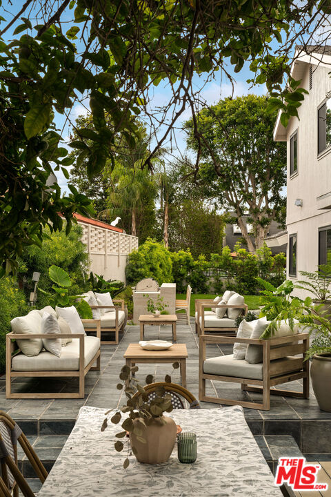 851 Dickson Street Marina del Rey, CA 90292 - Photo 20 of 39 a view of a patio with couches and a fire pit and large trees