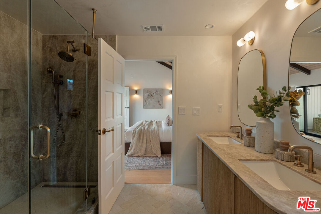 851 Dickson Street Marina del Rey, CA 90292 - Photo 26 of 39 a bathroom with a sink vanity granite tub and shower
