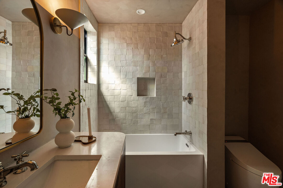 851 Dickson Street Marina del Rey, CA 90292 - Photo 30 of 39 a bathroom with a tub and a shower