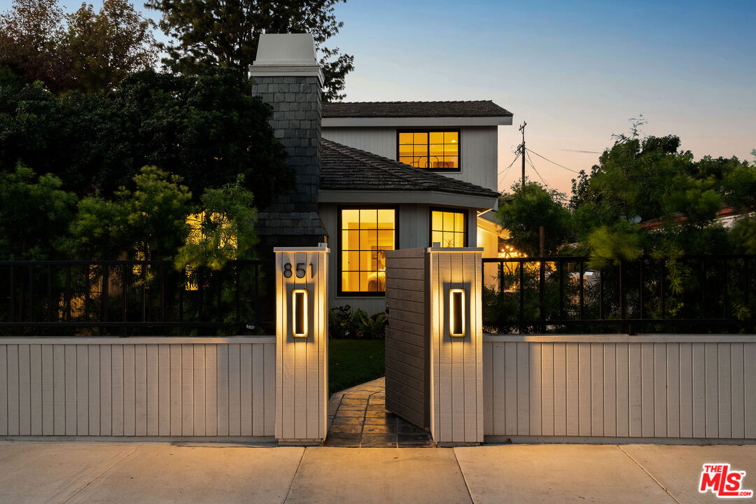 851 Dickson Street Marina del Rey, CA 90292 - Photo 3 of 39 a view of a house with a tree and wooden fence
