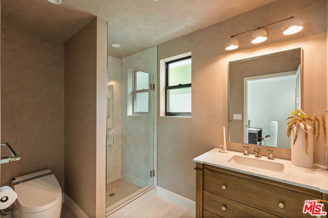 851 Dickson Street Marina del Rey, CA 90292 - Photo 35 of 39 a bathroom with a toilet a sink and mirror