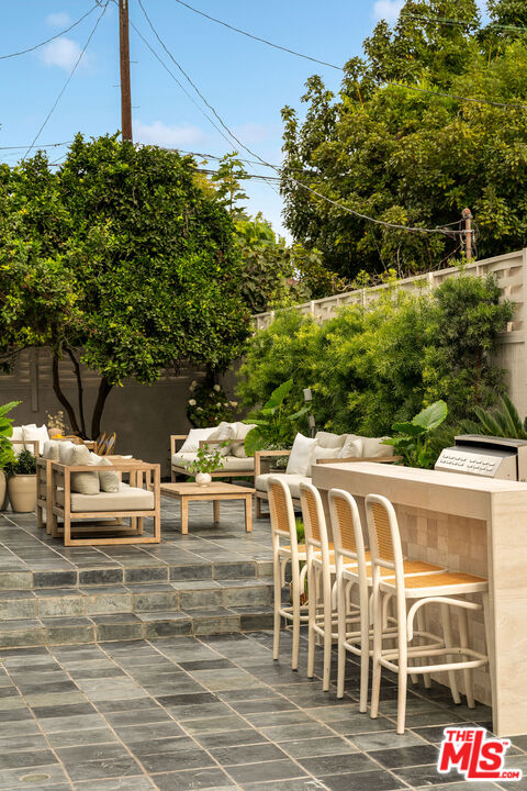 851 Dickson Street Marina del Rey, CA 90292 - Photo 5 of 39 a view of a patio with table and chairs and potted plants