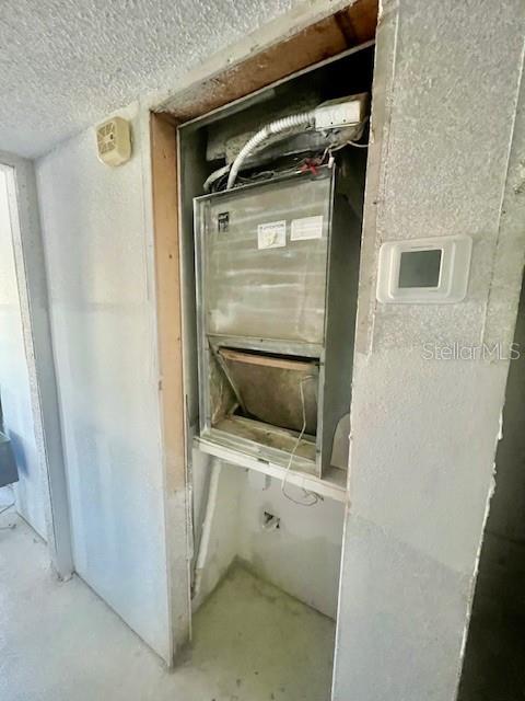 4832 Jasper Drive, Unit 107 New Port Richey, FL 34652 - Photo 13 of 27 a utility room with a shower and sink