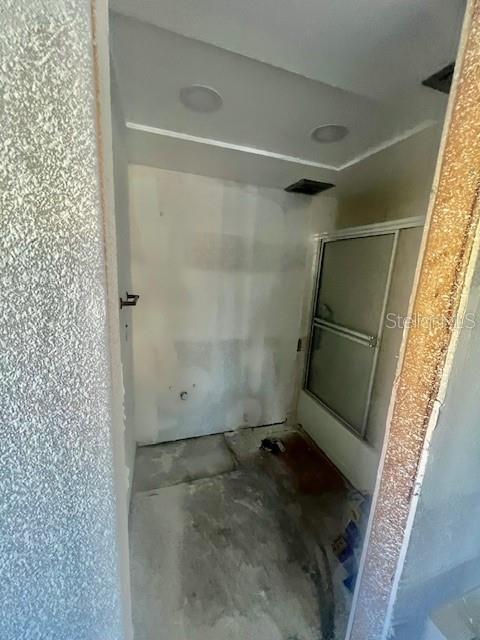 4832 Jasper Drive, Unit 107 New Port Richey, FL 34652 - Photo 14 of 27 a bathroom with a window and a shower