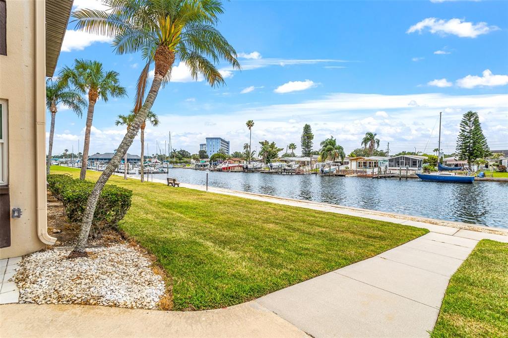 4832 Jasper Drive, Unit 107 New Port Richey, FL 34652 - Photo 17 of 27 a view of a swimming pool and lounge chair