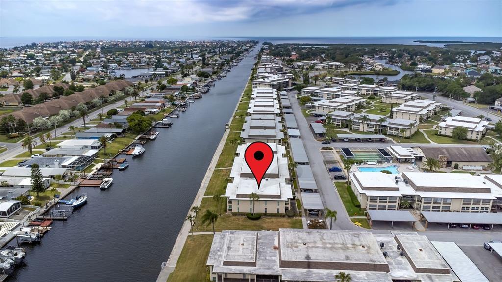 4832 Jasper Drive, Unit 107 New Port Richey, FL 34652 - Photo 19 of 27 an aerial view of residential houses with outdoor space