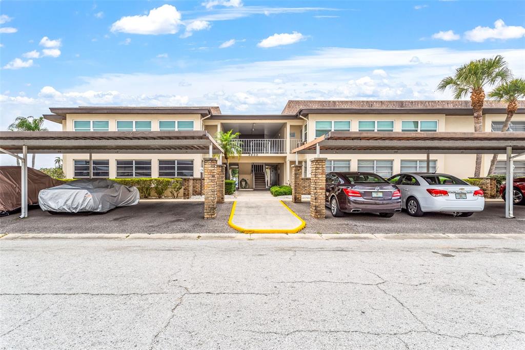 4832 Jasper Drive, Unit 107 New Port Richey, FL 34652 - Photo 2 of 27 a car parked in front of a building