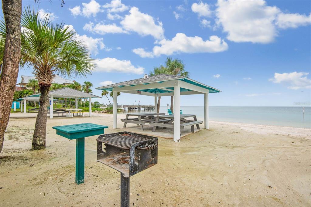 4832 Jasper Drive, Unit 107 New Port Richey, FL 34652 - Photo 26 of 27 a view of a chairs and table in backyard of a house