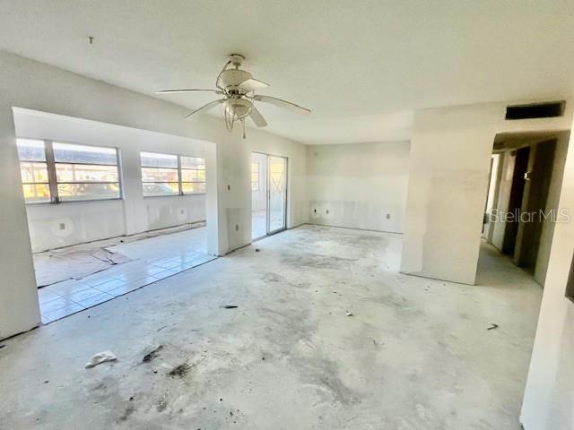 4832 Jasper Drive, Unit 107 New Port Richey, FL 34652 - Photo 4 of 27 en empty room with window and a ceiling fan