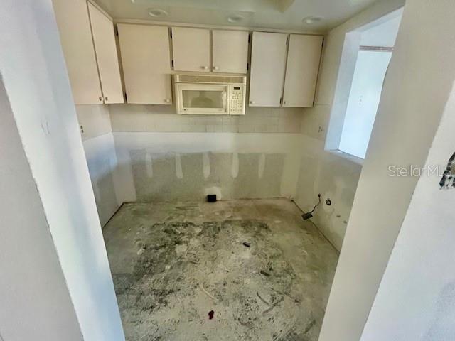 4832 Jasper Drive, Unit 107 New Port Richey, FL 34652 - Photo 6 of 27 a bathroom with a sink and a shower