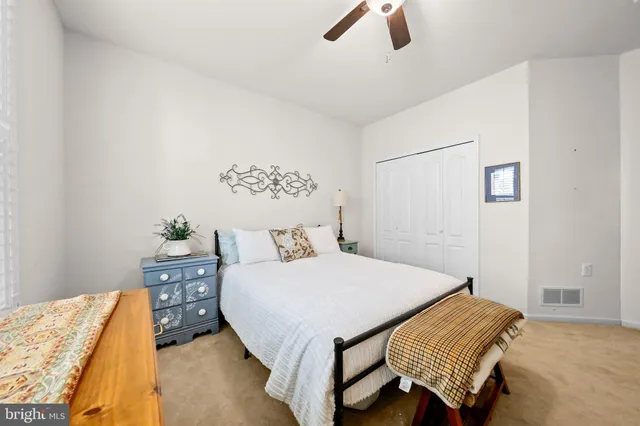 a bathroom with a toilet a sink and a mirror