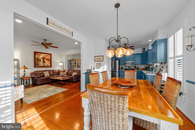 a kitchen with a refrigerator sink and cabinets