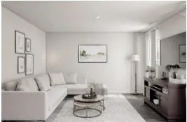 a living room with furniture kitchen and a table