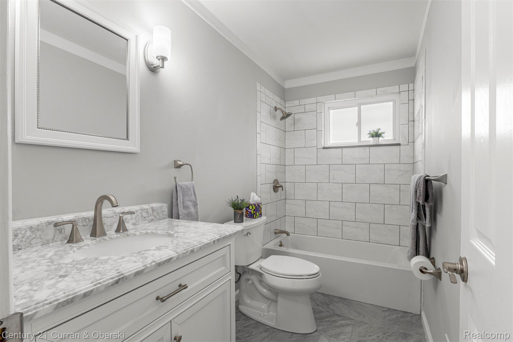 7120 Jackson Street Taylor, MI 48180 - Photo 9 of 24 Full bath featuring vanity, shower / tub combination, and marble look tile flooring