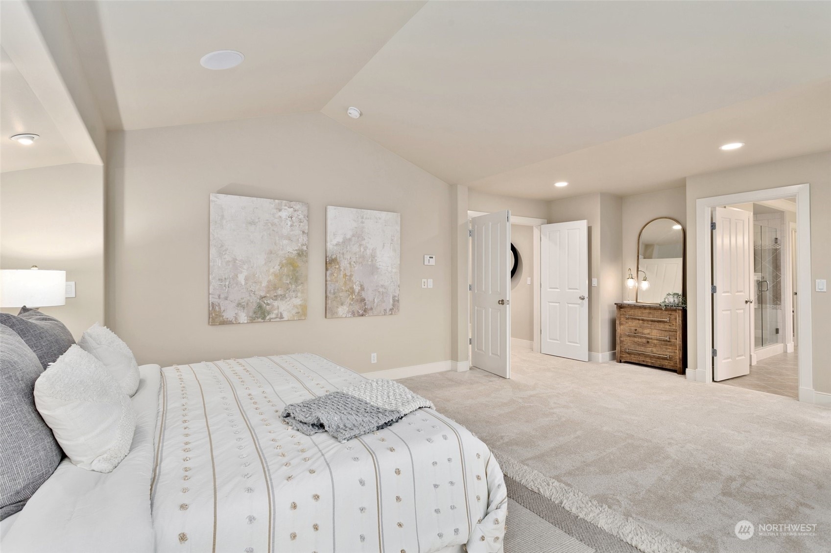 573 Saddleback Loop Way Northwest Issaquah, WA 98027 - Photo 19 of 40 a spacious bedroom with a large bed mirror and window