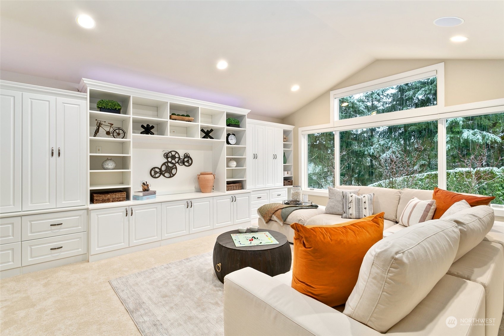 573 Saddleback Loop Way Northwest Issaquah, WA 98027 - Photo 25 of 40 a living room with furniture cabinets and a large window