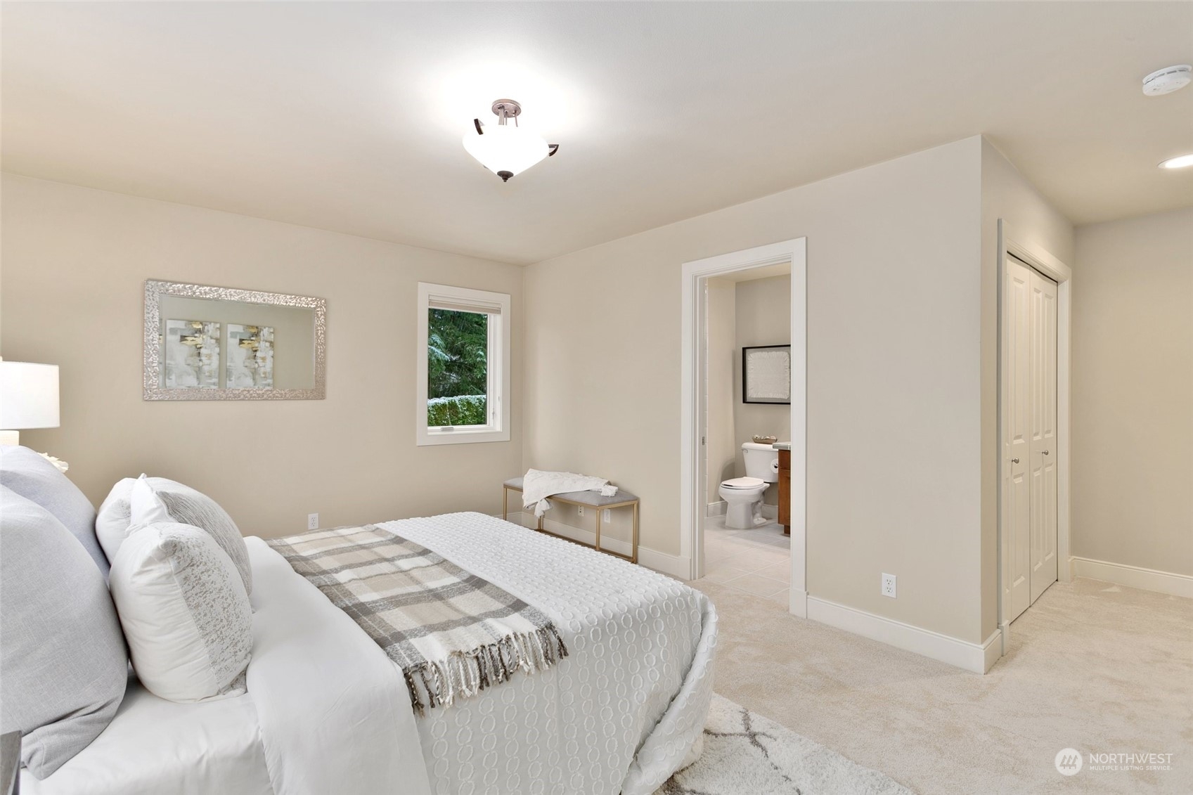 573 Saddleback Loop Way Northwest Issaquah, WA 98027 - Photo 28 of 40 a bedroom with a bed and a lamp
