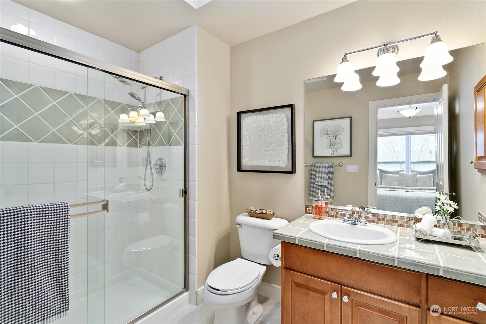 573 Saddleback Loop Way Northwest Issaquah, WA 98027 - Photo 29 of 40 a bathroom with a granite countertop sink toilet and shower