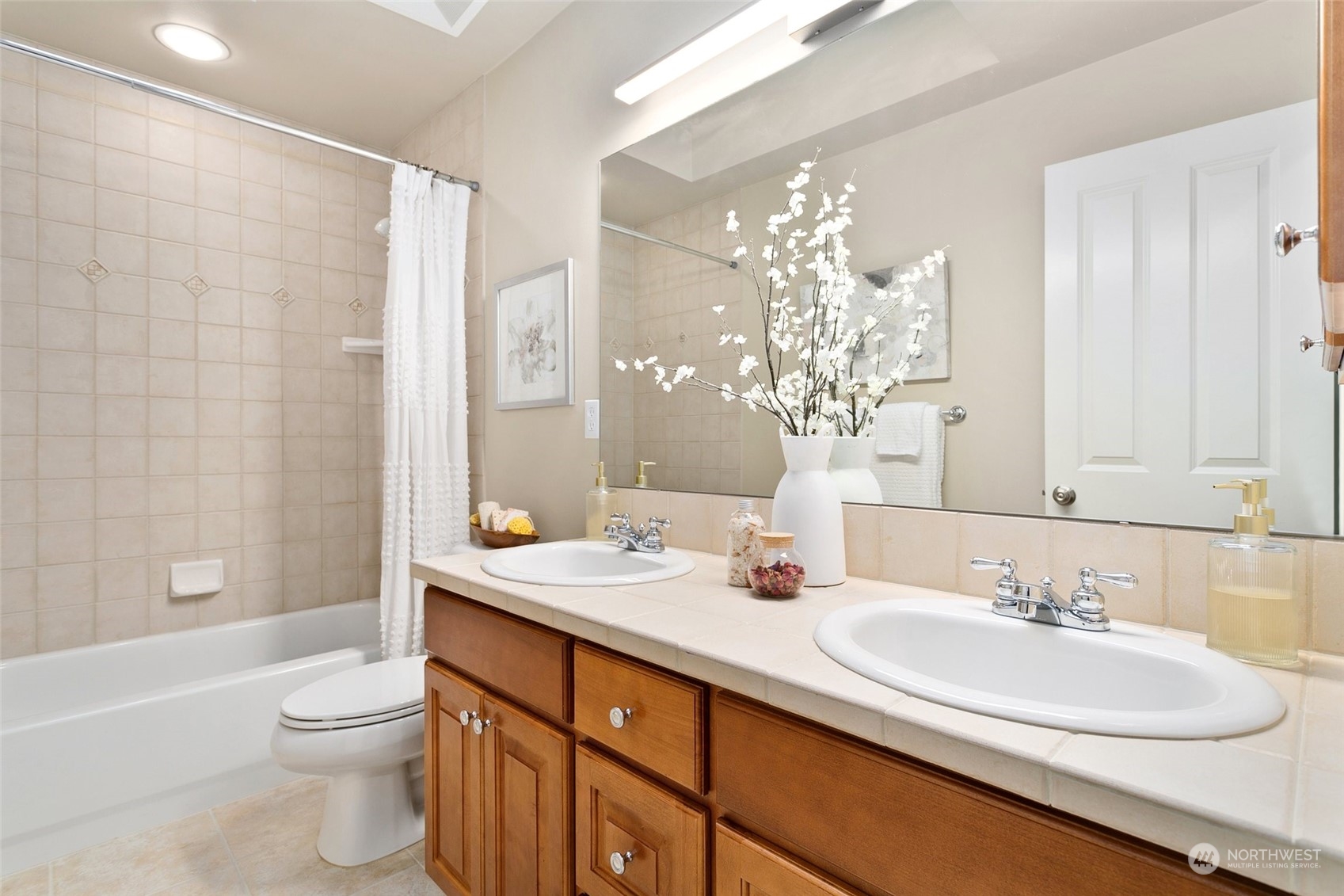 573 Saddleback Loop Way Northwest Issaquah, WA 98027 - Photo 32 of 40 a bathroom with a double vanity sink toilet and shower