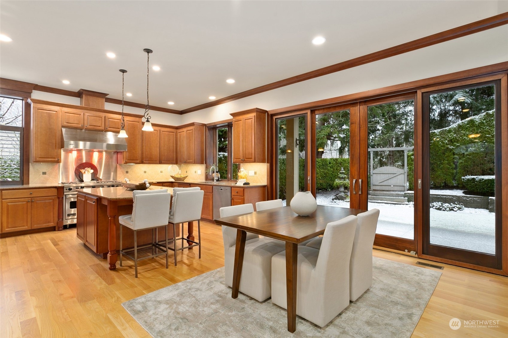 573 Saddleback Loop Way Northwest Issaquah, WA 98027 - Photo 8 of 40 a dining room with furniture a large window and a table