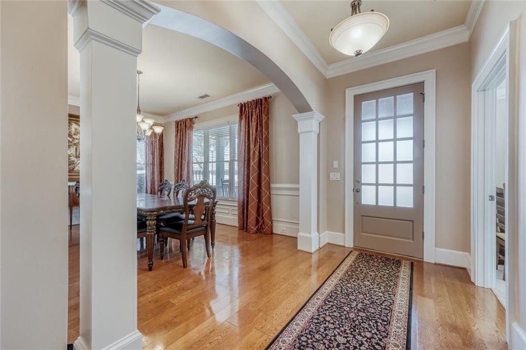 2380 Muskogee Lane Braselton, GA 30517 - Photo 3 of 30 a dining room with wooden floor and a rug