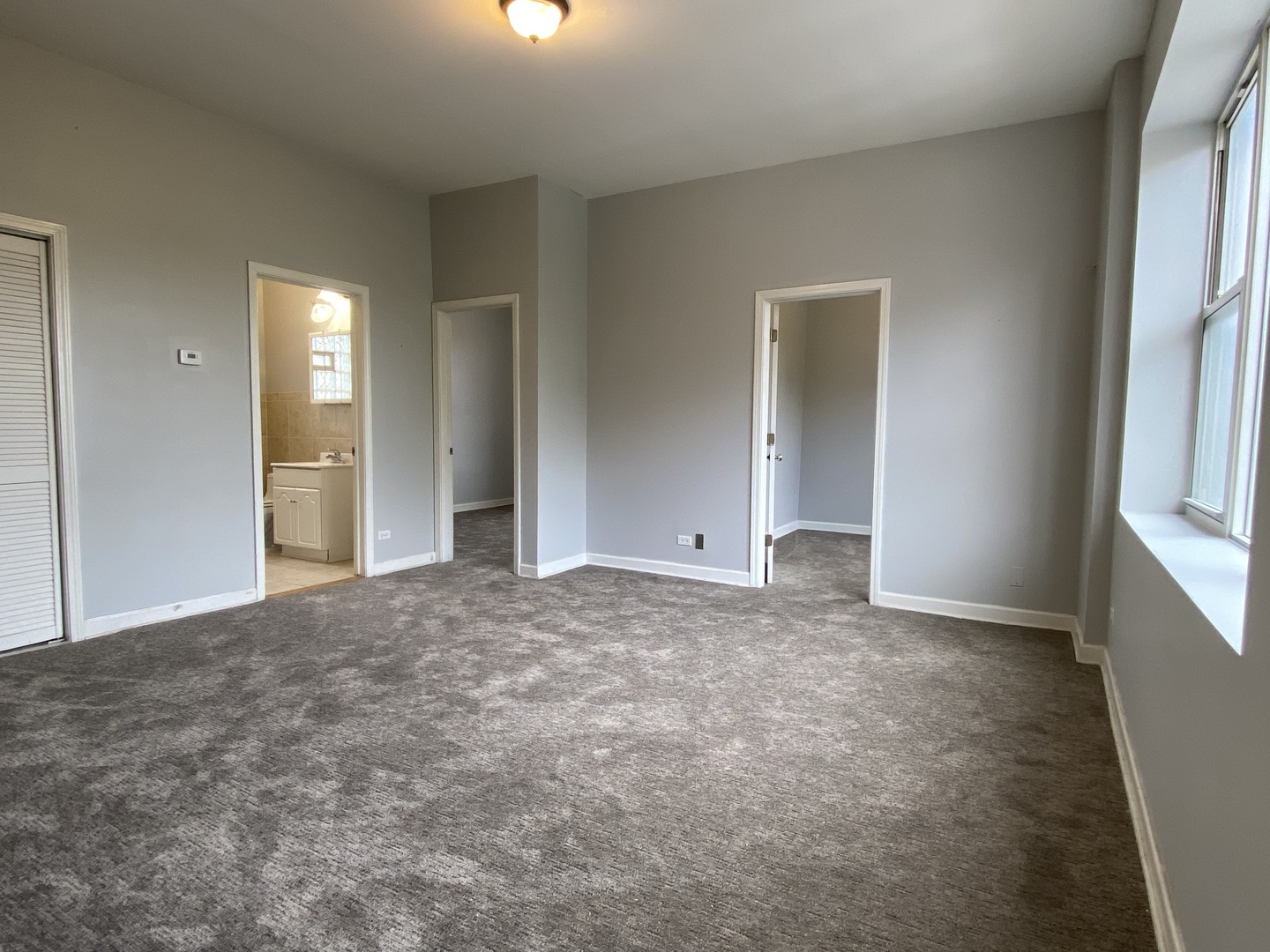 Undisclosed Address Chicago, IL 60622 - Photo 3 of 18 an empty room with windows and closet