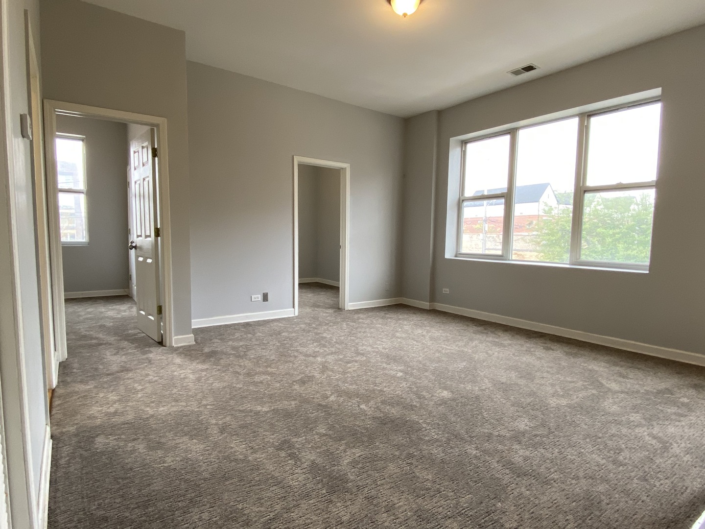 Undisclosed Address Chicago, IL 60622 - Photo 4 of 18 an empty room with windows and closet