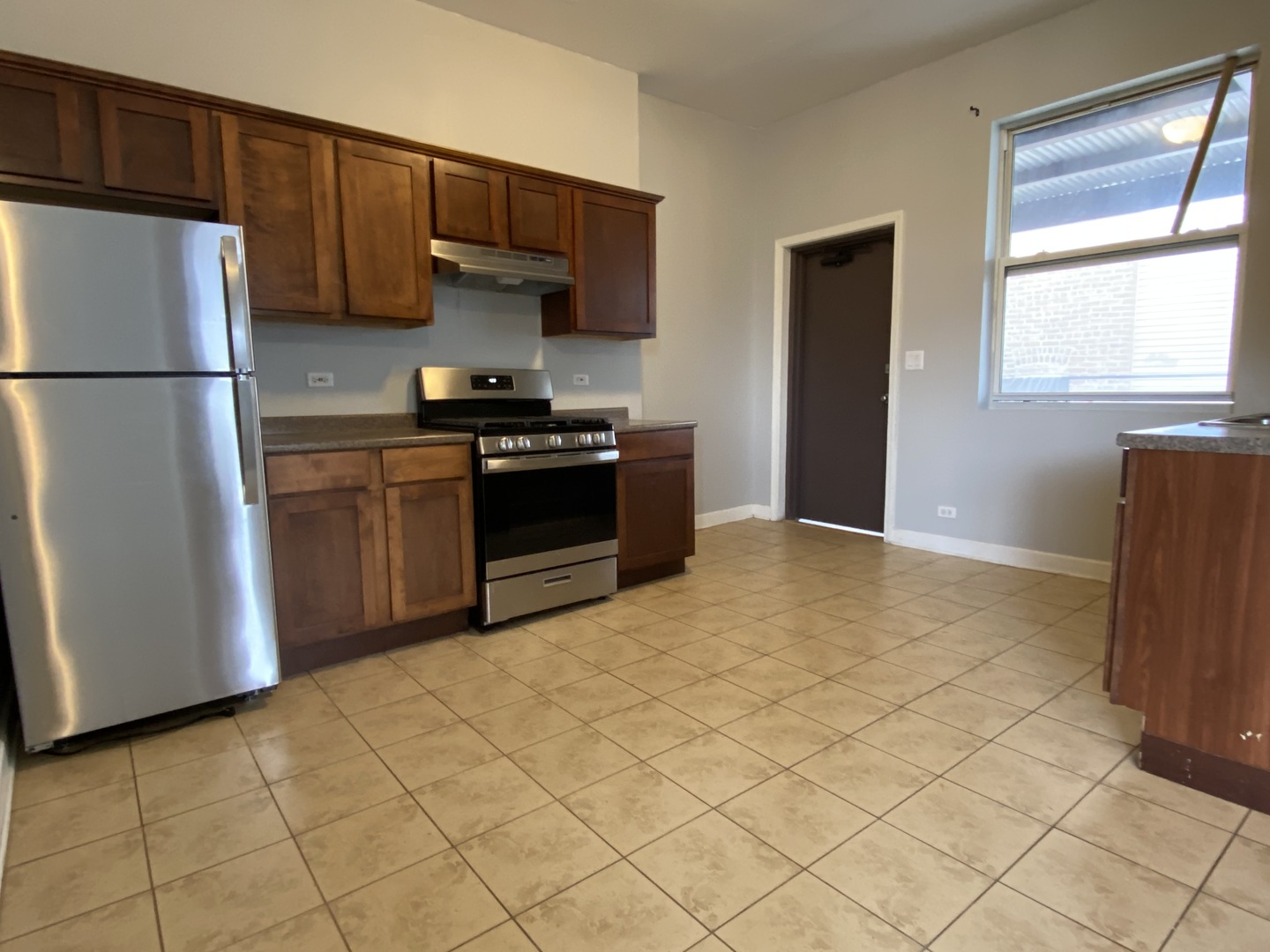 Undisclosed Address Chicago, IL 60622 - Photo 6 of 18 a kitchen with stainless steel appliances granite countertop a refrigerator stove and a sink