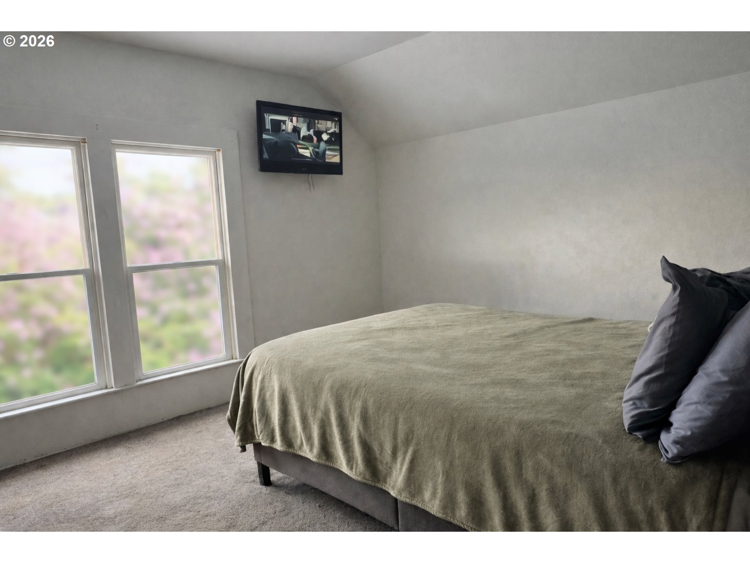 63563 Booth Lane La Grande, OR 97850 - Photo 16 of 24 a bedroom with a bed and a window