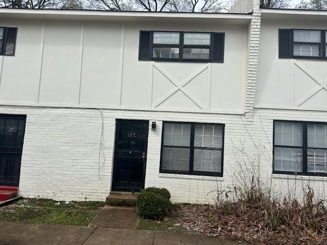 679 Miles, Unit 679 Memphis, TN 38111 - Photo 1 of 9 a front view of a house with garage