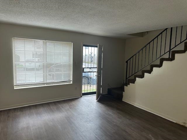 679 Miles, Unit 679 Memphis, TN 38111 - Photo 3 of 9 a view of an empty room with wooden floor and stairs