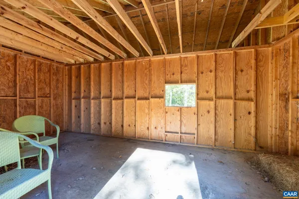 a view of a room with window and furniture