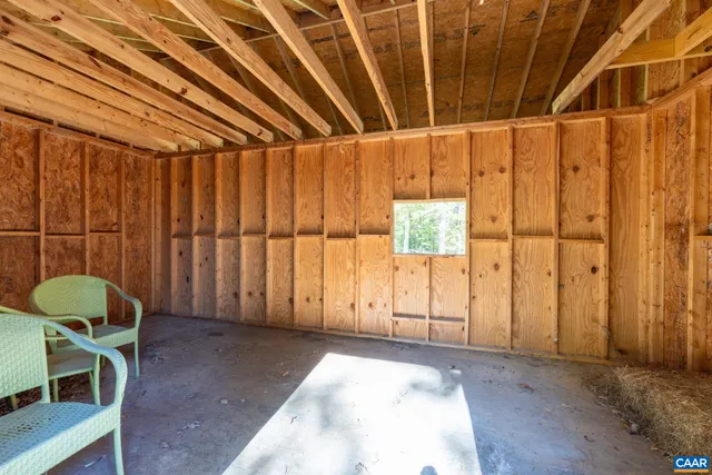 a view of a room with window and furniture