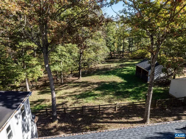 a view of a house with a tree