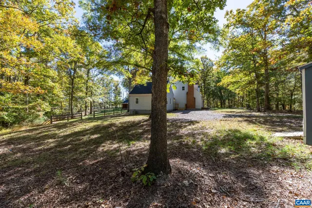 a view of a wooden deck with a yard